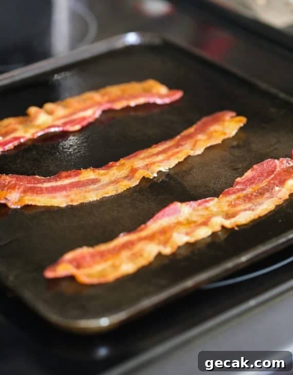 Pancake Bacon Dippers! A soft pancake surrounds a crispy piece of bacon that you can dip right in maple syrup!