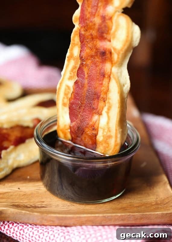 Pancake Bacon Dippers! A soft pancake surrounds a crispy piece of bacon that you can dip right in maple syrup!