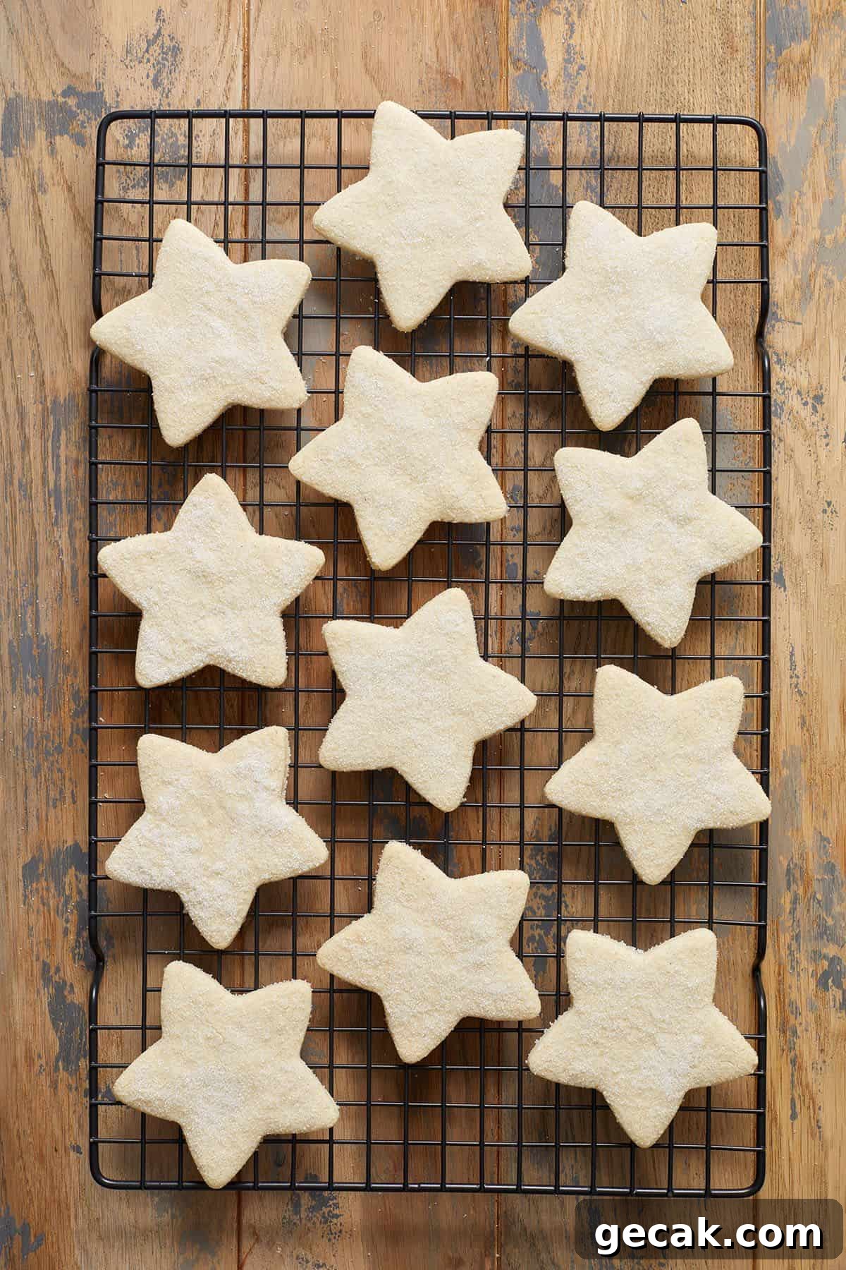 Baked shortbread cookies sitting on a cooling rack.