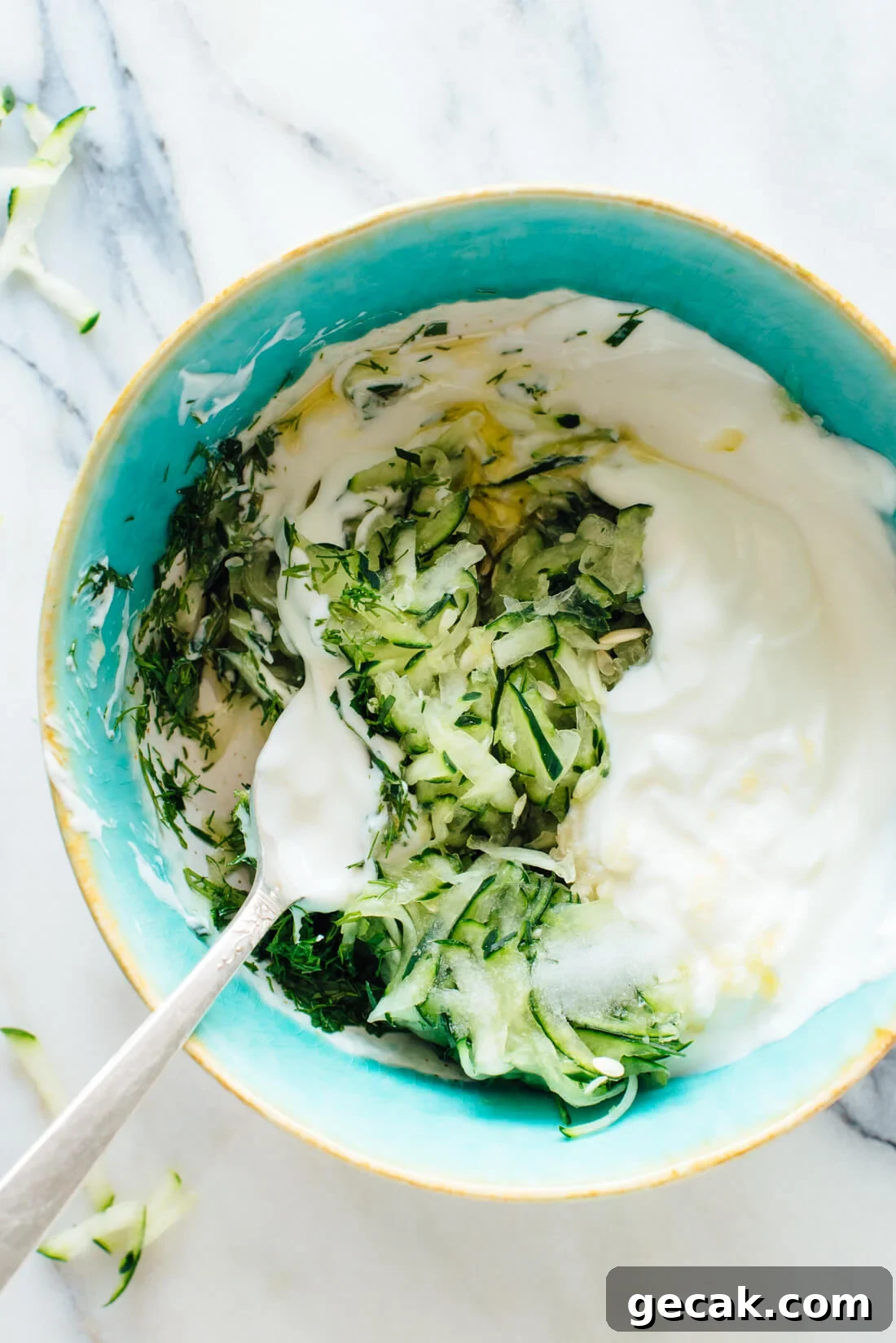 Traditional Greek Tzatziki sauce made with cucumber, yogurt, olive oil, lemon juice, garlic, and fresh dill and mint!