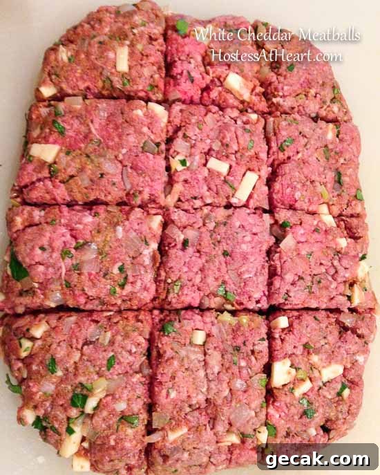 White Cheddar Meat divided to make meatballs.