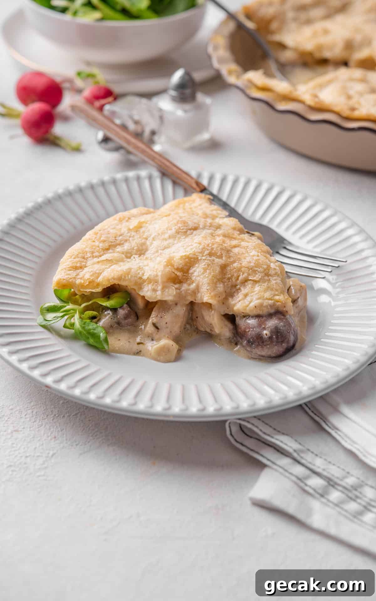 Creamy Chicken & Mushroom Pie Recipe for Home Baking 12 slice of mushroom and chicken pie on a plate.