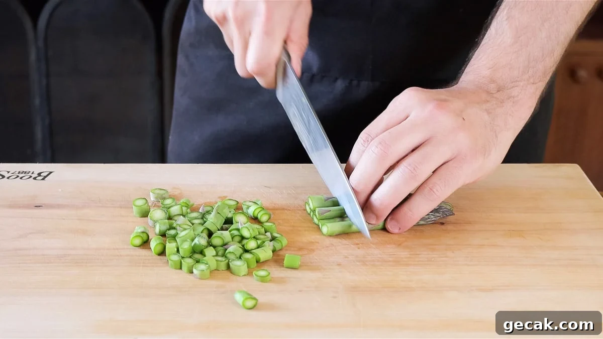 chopping the asparagus