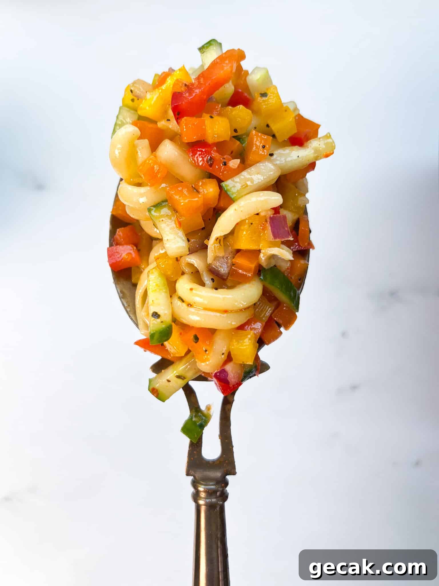 Italian Pasta Salad on a serving spoon