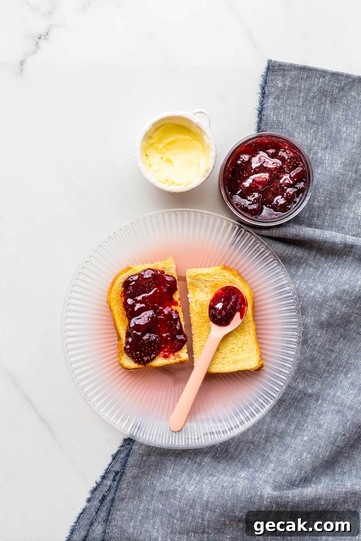 Strawberry jam served with brioche toast and butter.