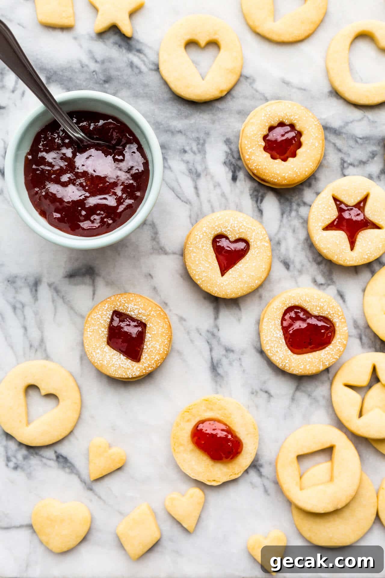Shortbread cookies sandwiched with strawberry jam.