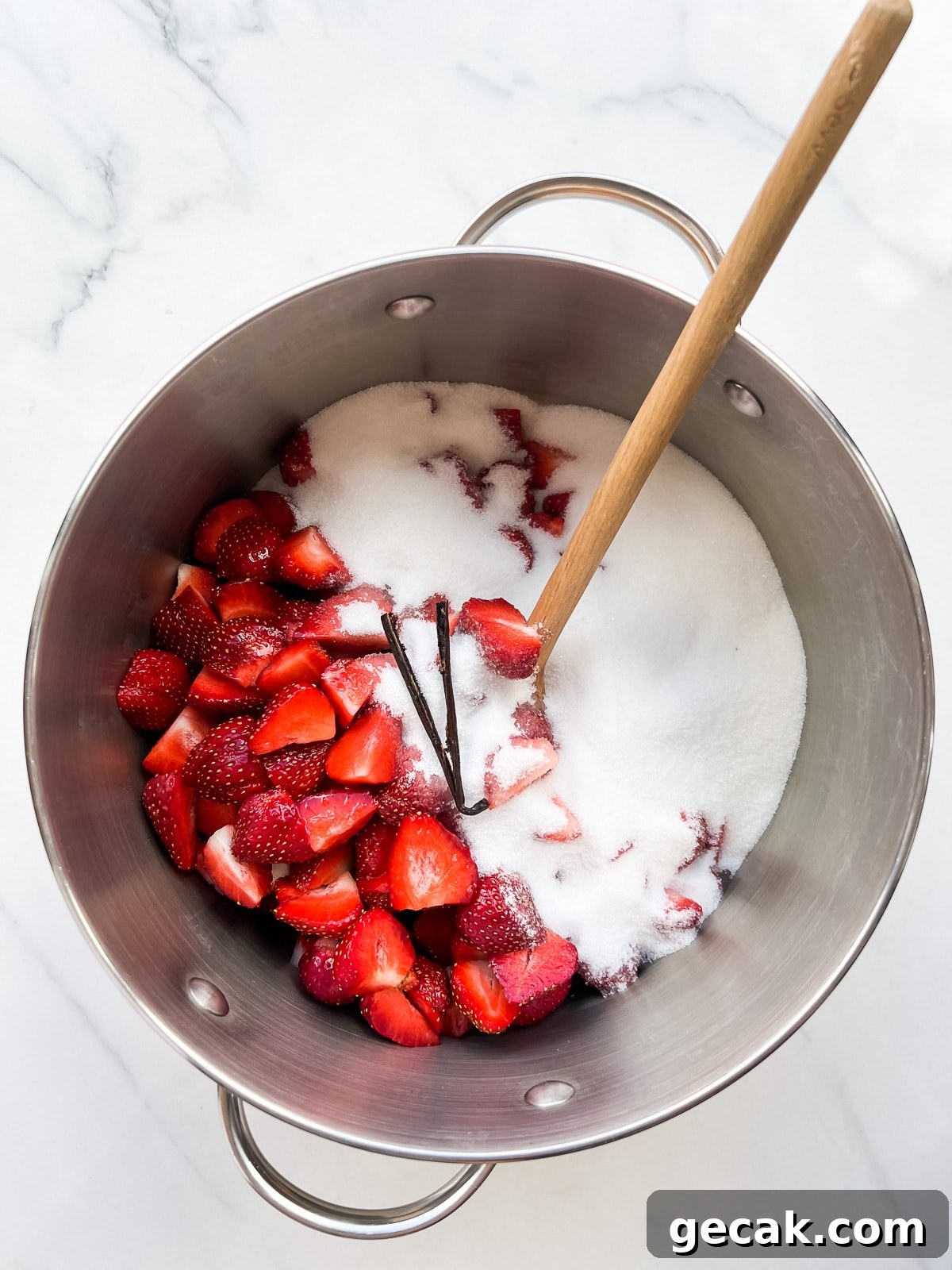 Strawberries combined with sugar and vanilla to macerate.