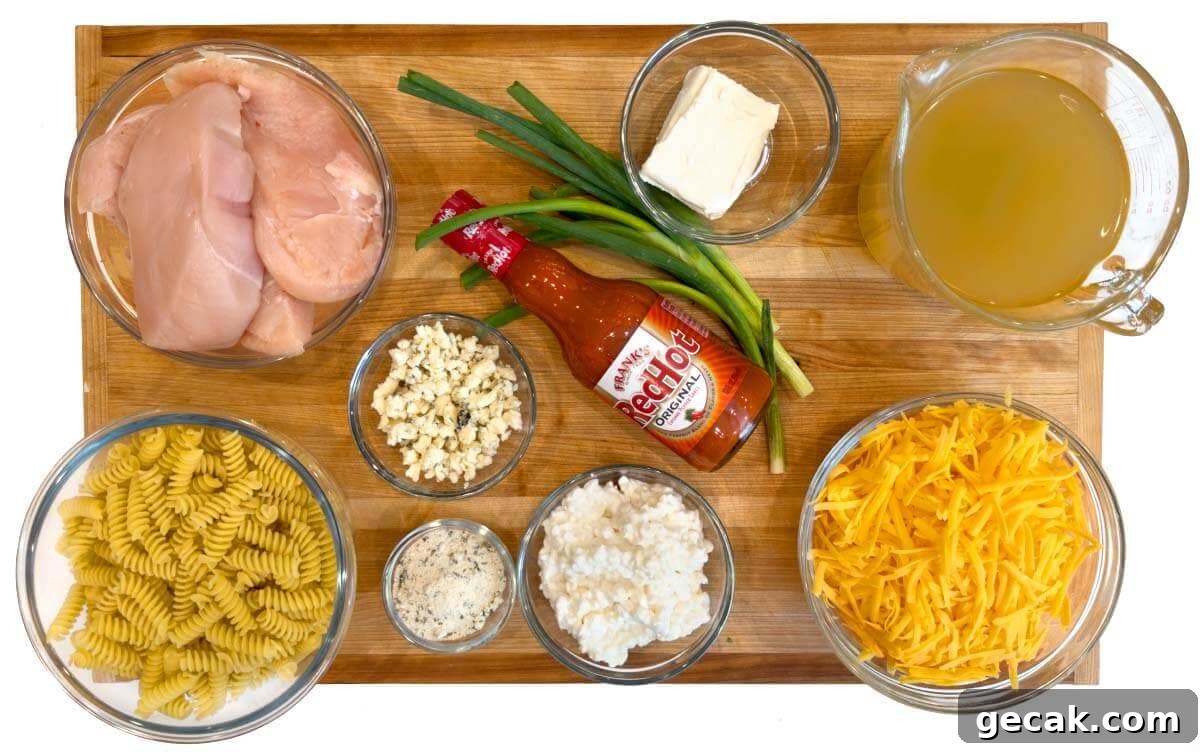 Crockpot Buffalo Chicken Mac and Cheese ingredients shot on a board
