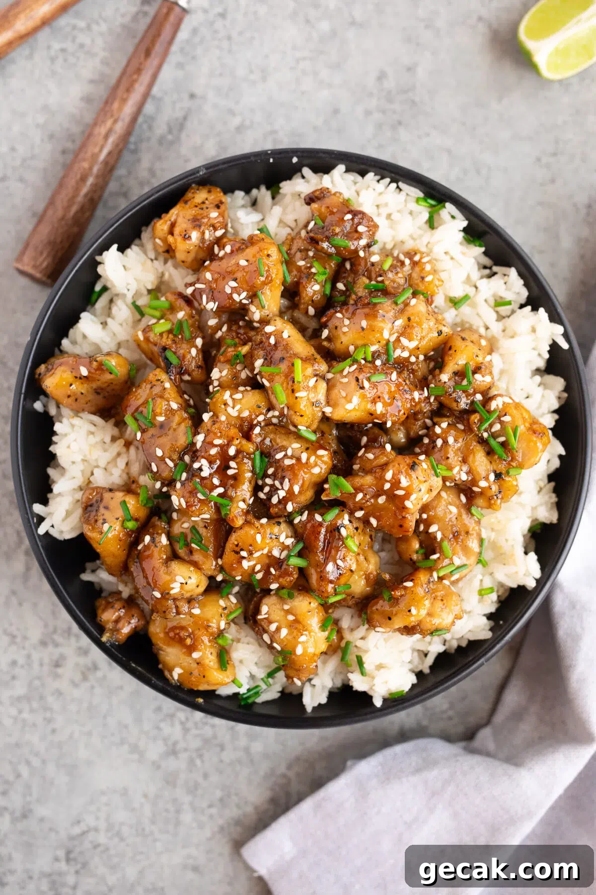 chicken with honey garlic sauce in a bowl with rice