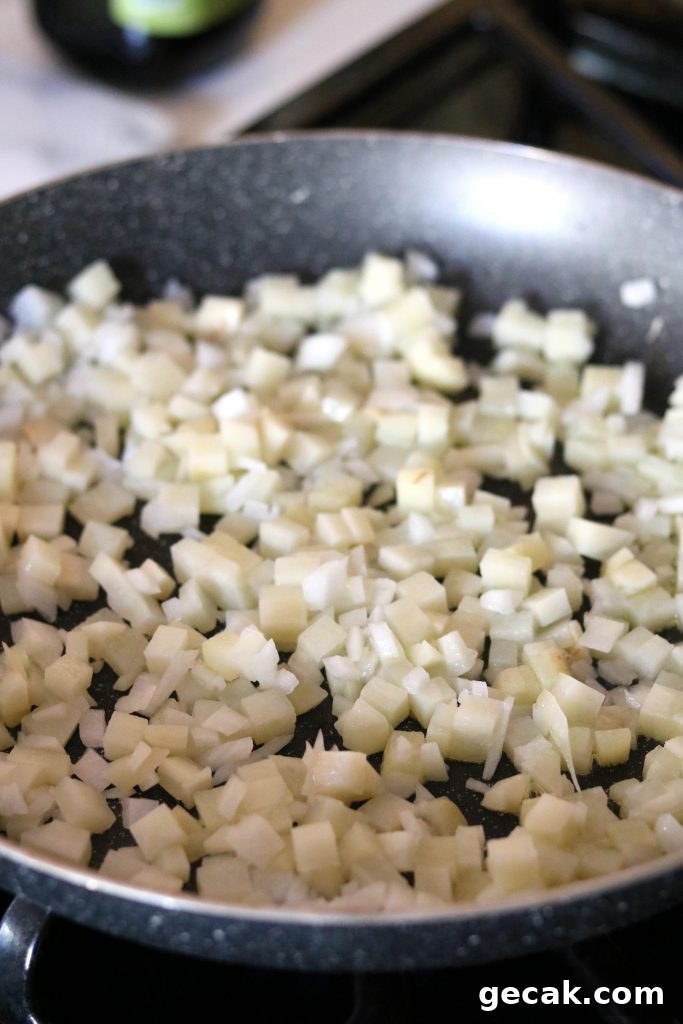 potatoes and onions in skillet