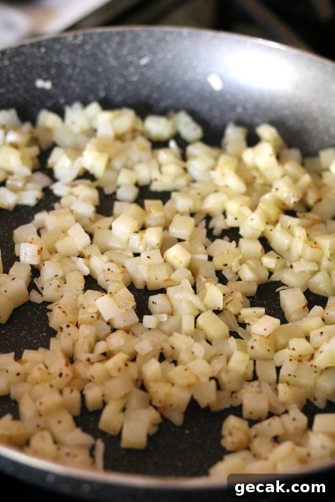 potatoes and onions in skillet cooked
