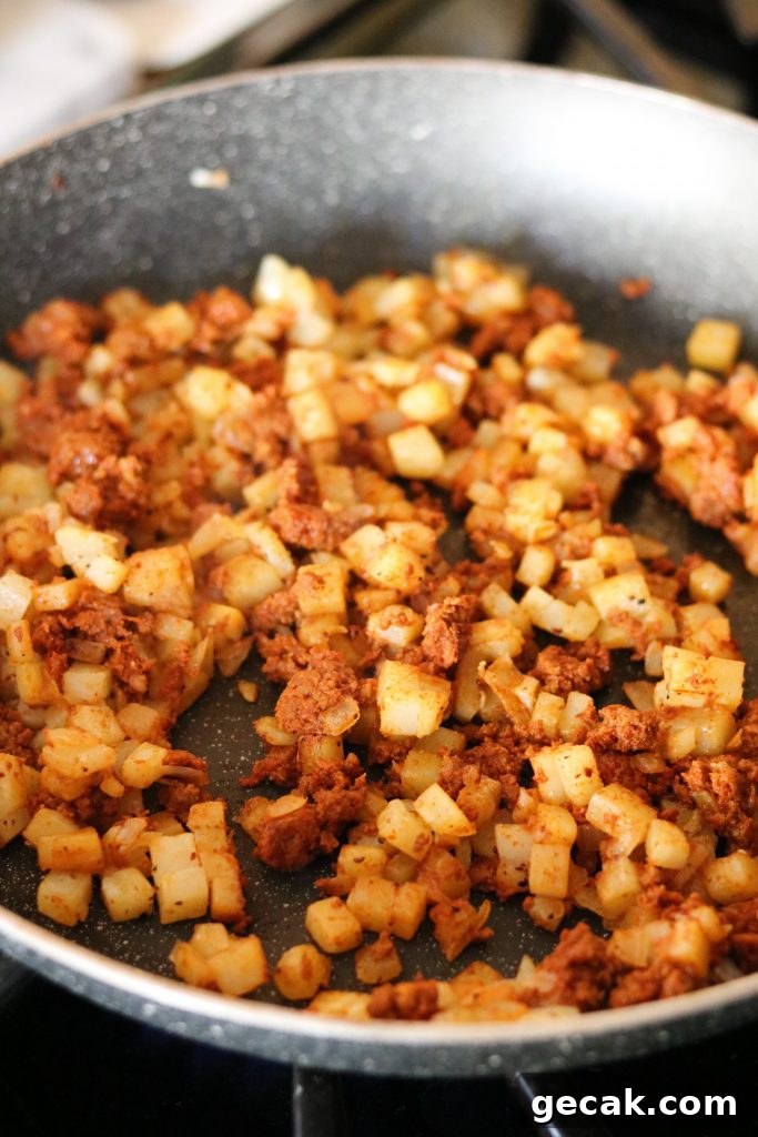 chorizo and potatoes, onions in skillet