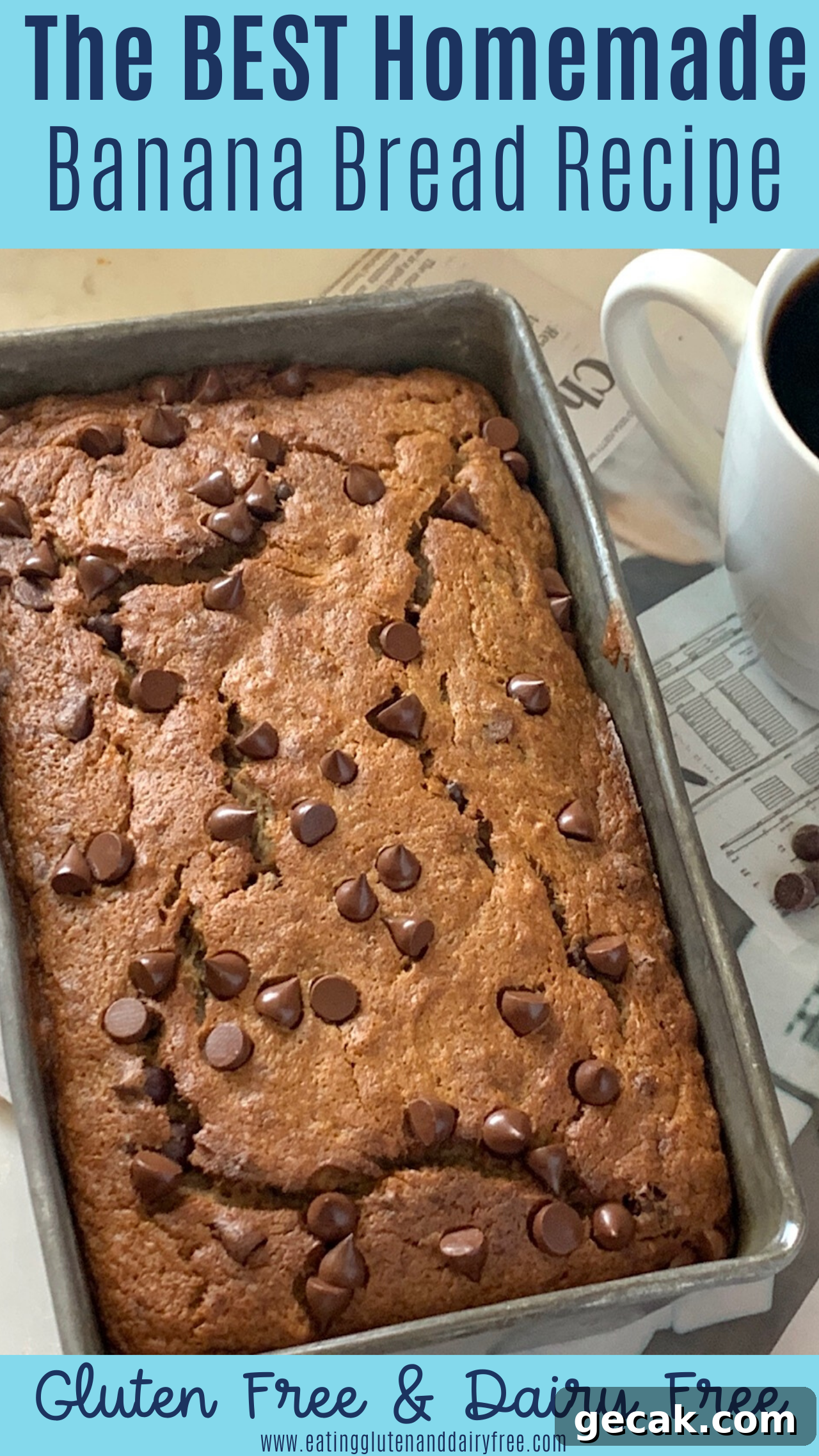 A bread loaf pan full of banana bread with chocolate chip on the top next to a mug of coffee. 