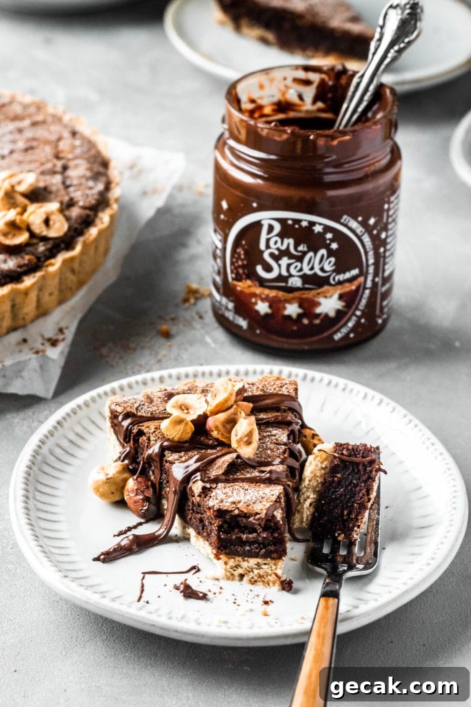 Chocolate Hazelnut Tart with Crunchy Hazelnut Crust 3 hazelnut brownie tart slice pan di stelle