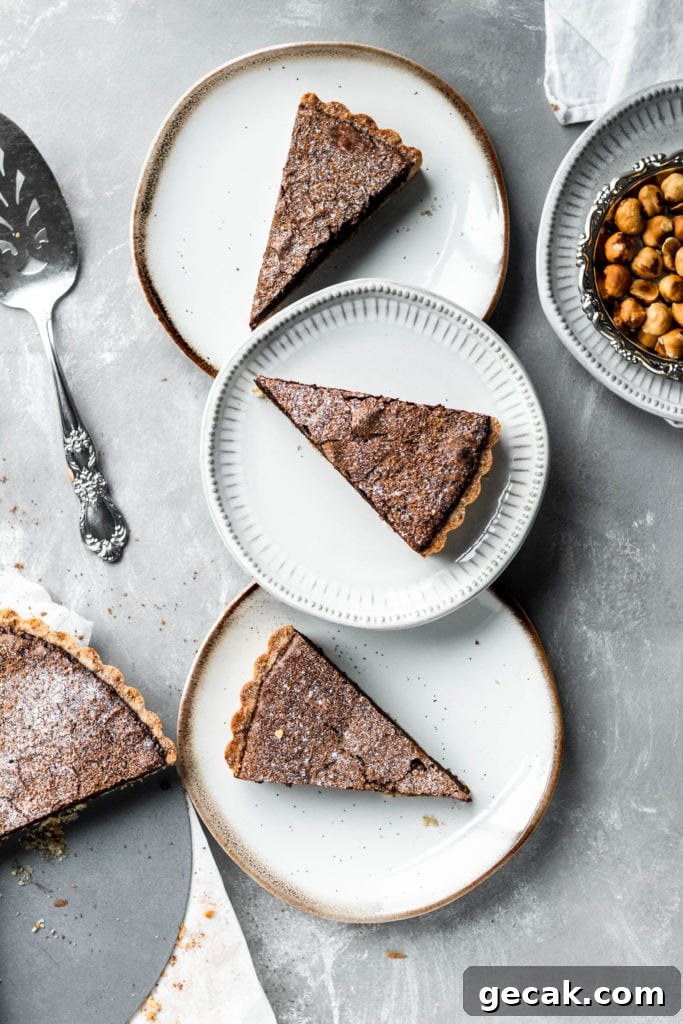 Chocolate Hazelnut Tart with Crunchy Hazelnut Crust 5 chocolate pie slices