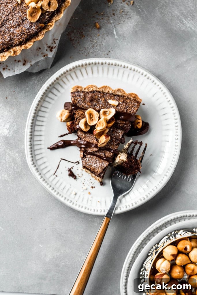 Chocolate Hazelnut Tart with Crunchy Hazelnut Crust 7 tart slice with toppings