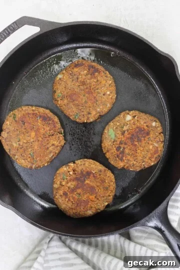 cast iron with four sweet potato burgers