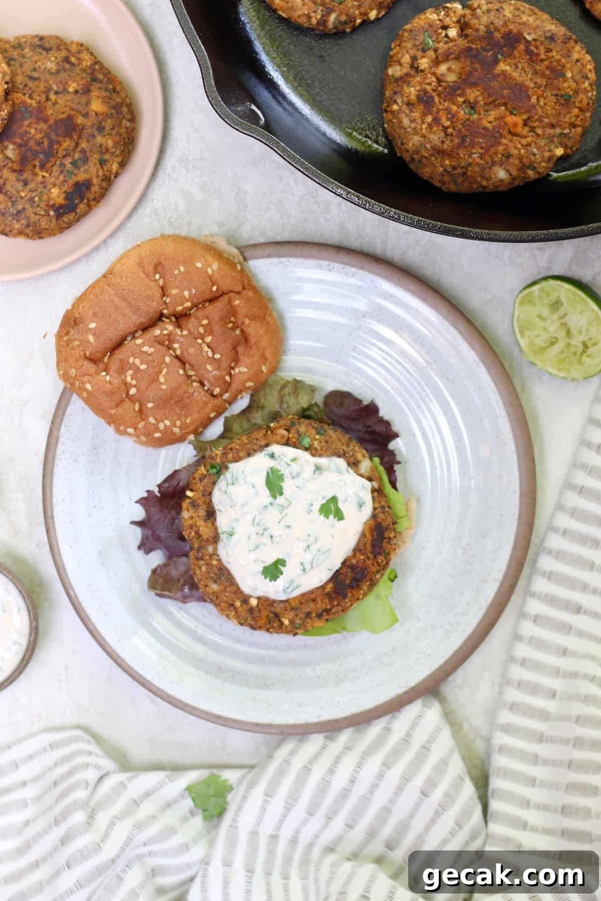 plate of veggie burger with yogurt topping