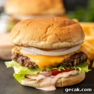 Savory cheeseburger with lettuce and tomato.