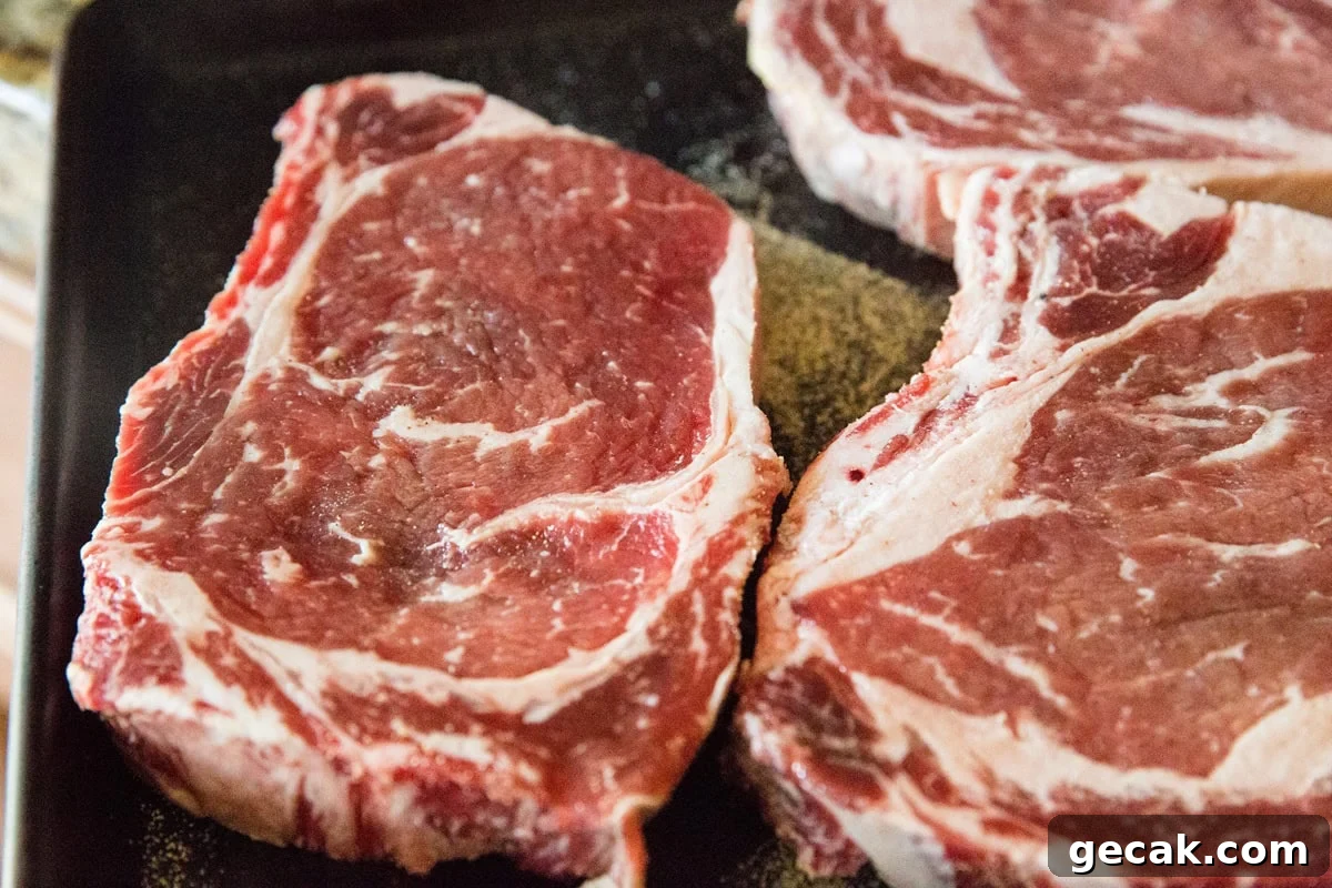How to Grill the Perfect Steak Every Time 6 Dry brined steak on a baking sheet, ready to be cooked