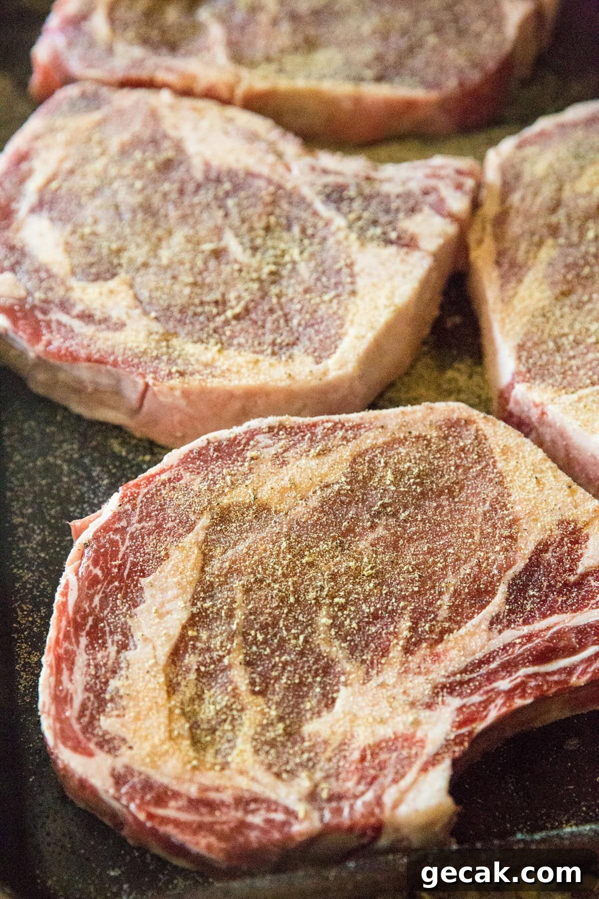 How to Grill the Perfect Steak Every Time 7 Bone-in ribeye steak seasoned with salt, garlic powder, and black pepper