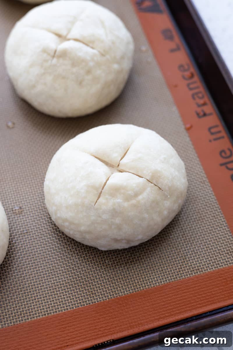 A bun with an X scored across the top. 
