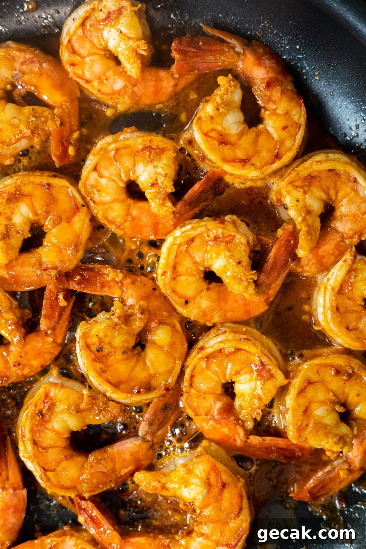 Cooked chili lime shrimp in a skillet.