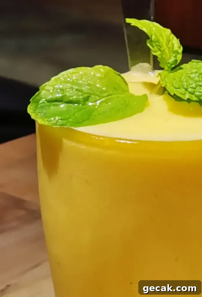 Caribou Lou Cocktail Recipe: How to Make the Tropical Rum Drink 4 Caribou Lou poured into glass