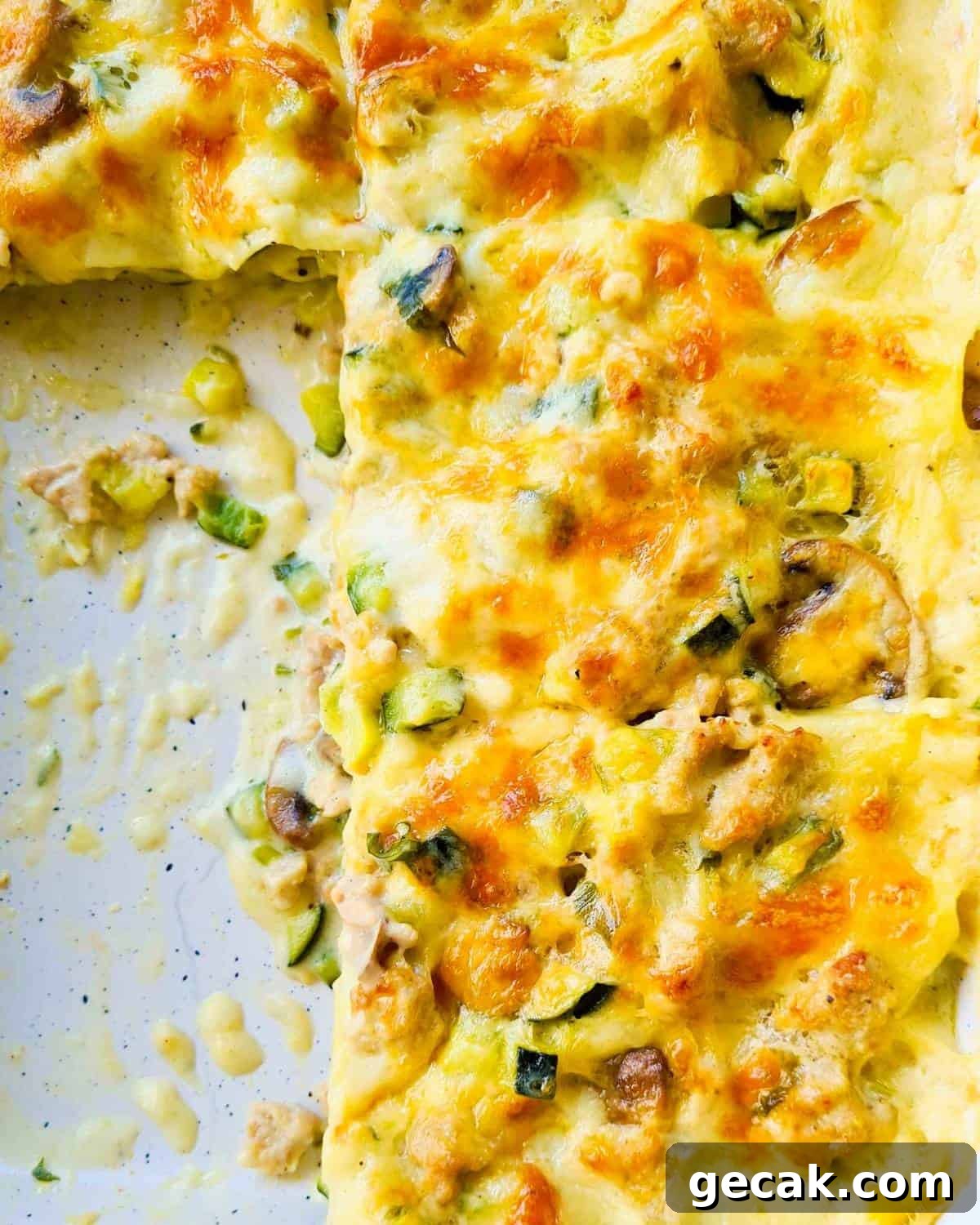 Slices of chicken lasagna in a baking dish