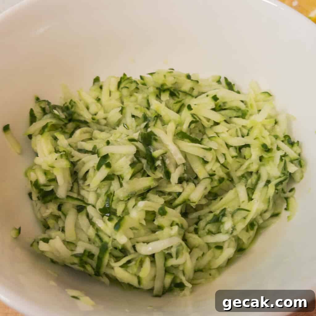 Authentic Greek Tzatziki Sauce Recipe — How to Make It at Home 4 Step 1 Grate the cucumber using a food processor or standard grater