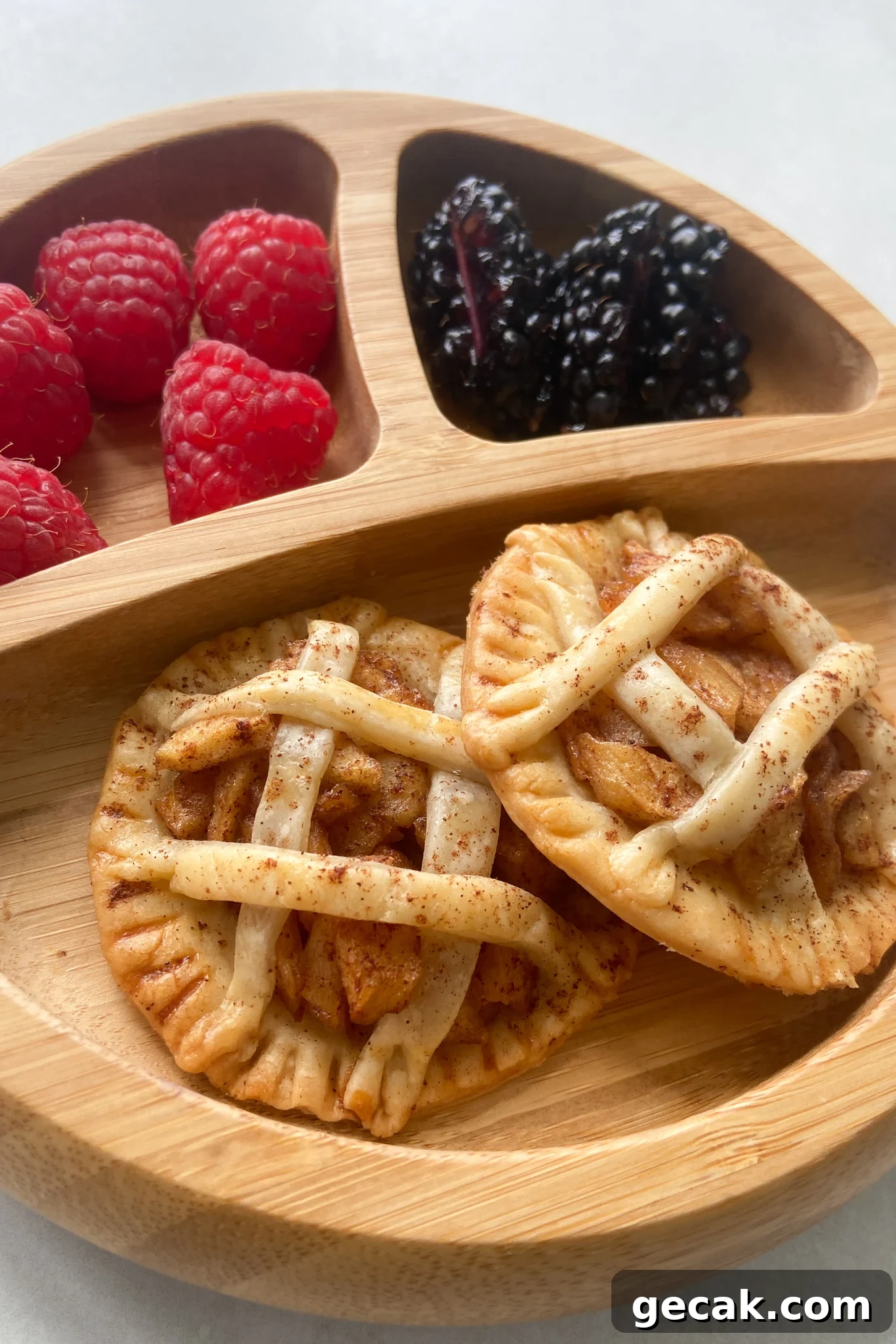 Mini apple pies served with berries