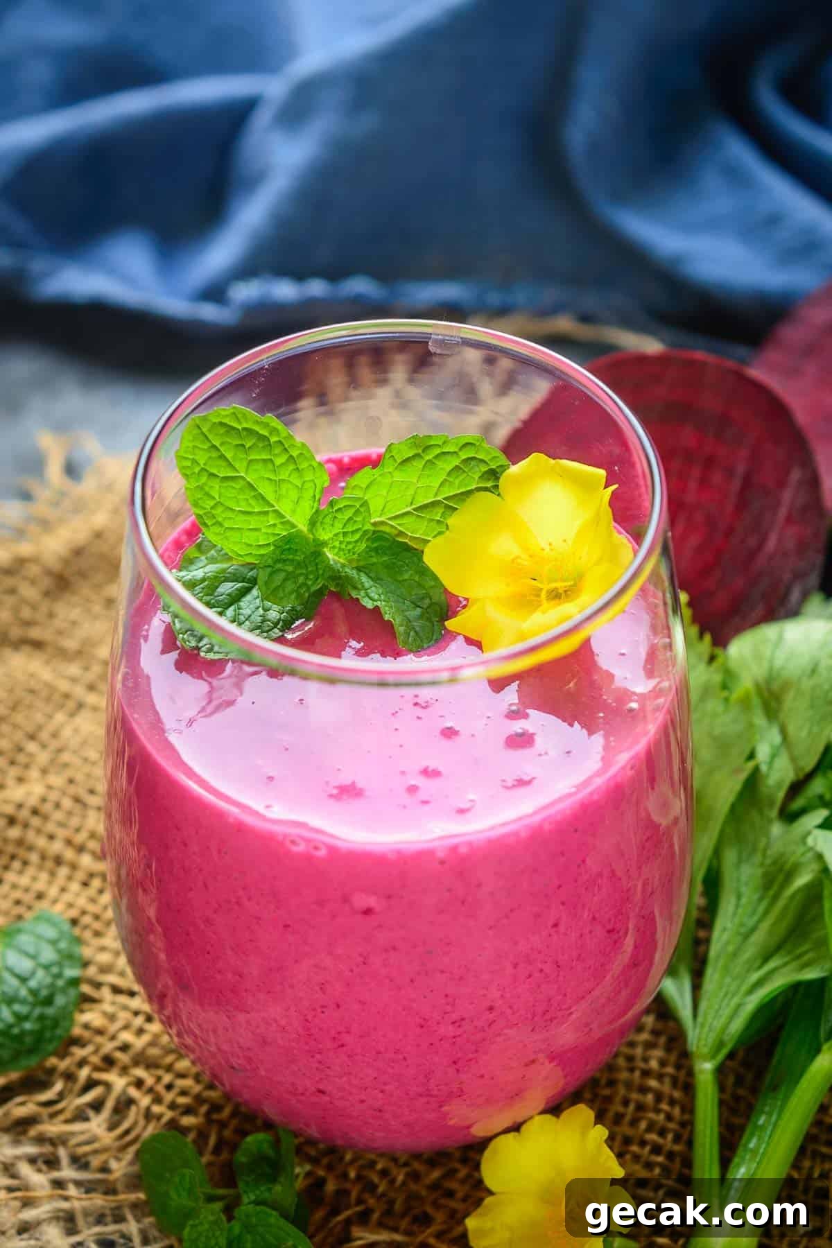 Banana beet smoothie served in a glass.