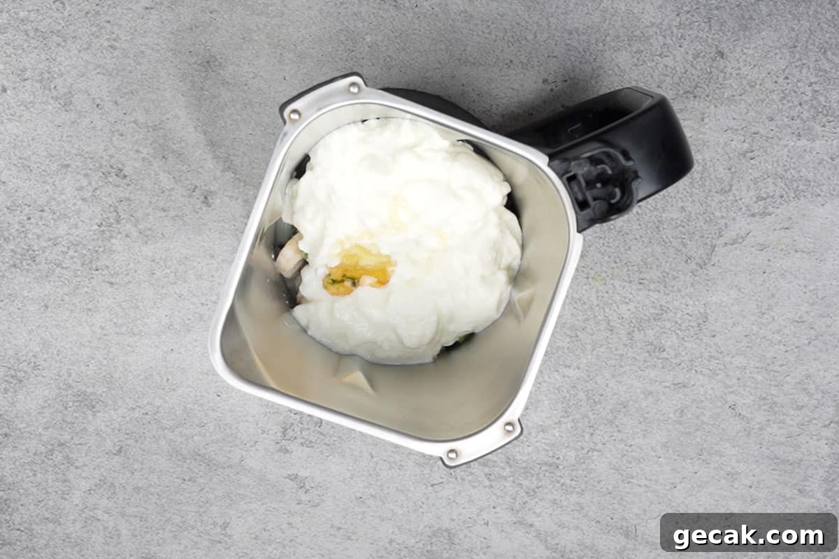 All the ingredients added to a blender.