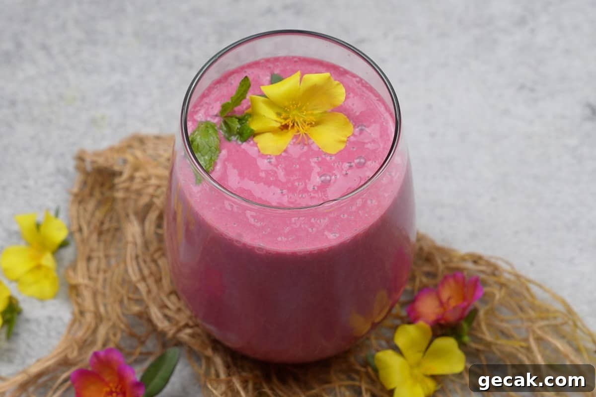 Banana beet smoothie served in a glass.