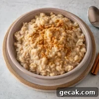 Creamy oatmeal topped with a sprinkle of cinnamon and crushed nuts.