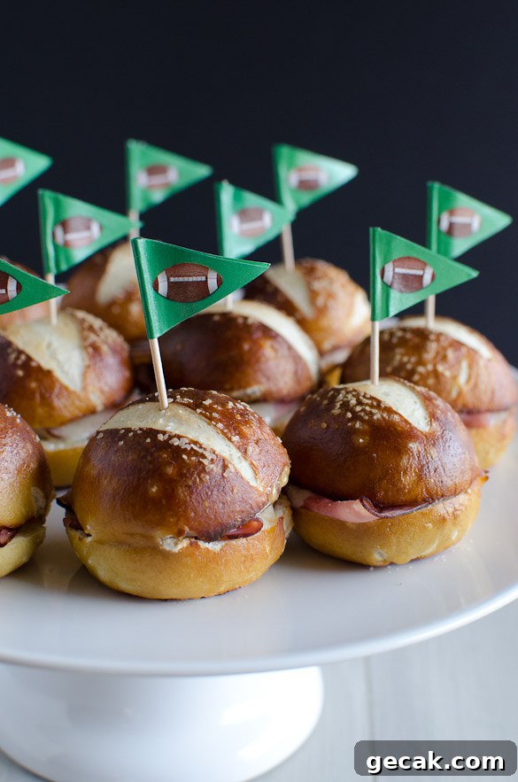 These Ham and Cheese Soft Pretzel Sliders are the perfect finger food for your tailgate party on game day. Everyone loves a good soft pretzel bun!