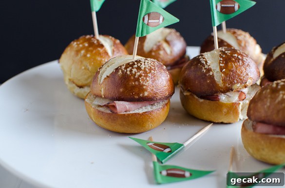 These Ham and Cheese Soft Pretzel Sliders are the perfect finger food for your tailgate party on game day. Everyone loves a good soft pretzel bun!