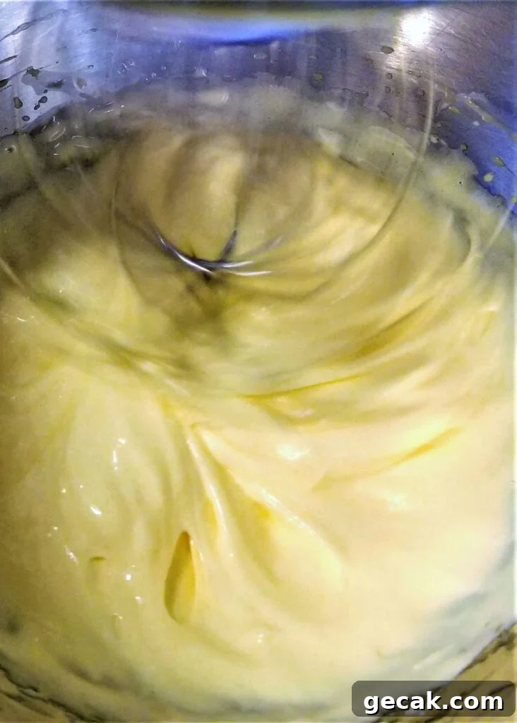 whipping sugar syrup into egg yolks