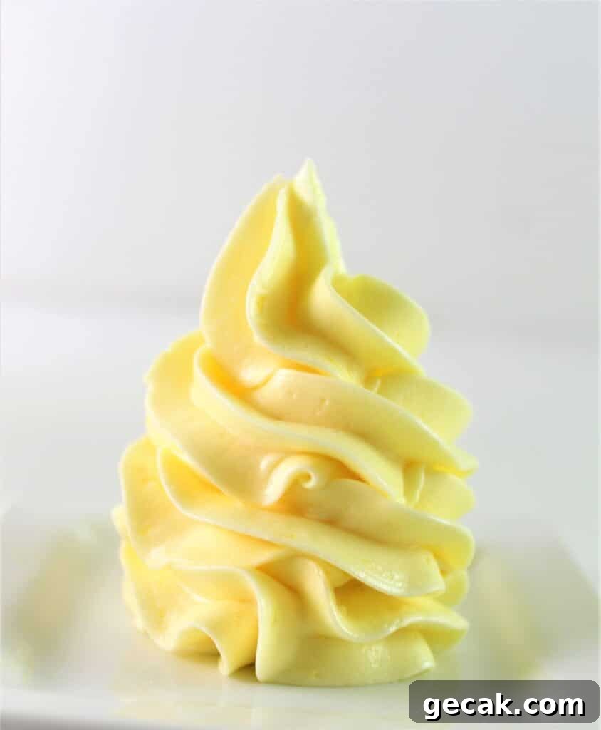 french buttercream piped onto a small white plate