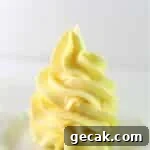 french buttercream piped onto a small white plate