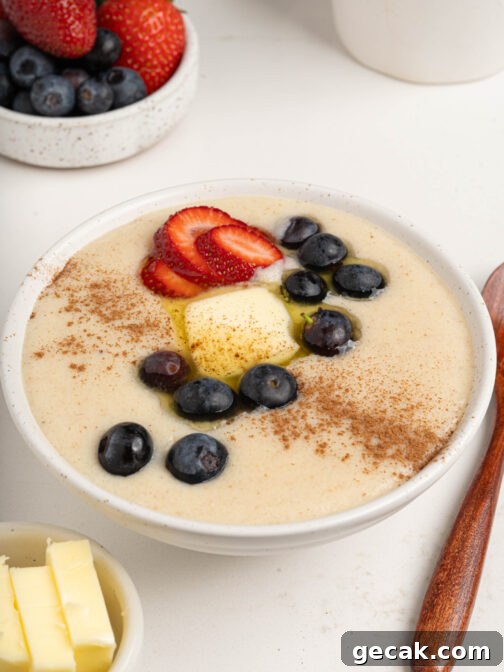 A bowl of farina with berries and butter.