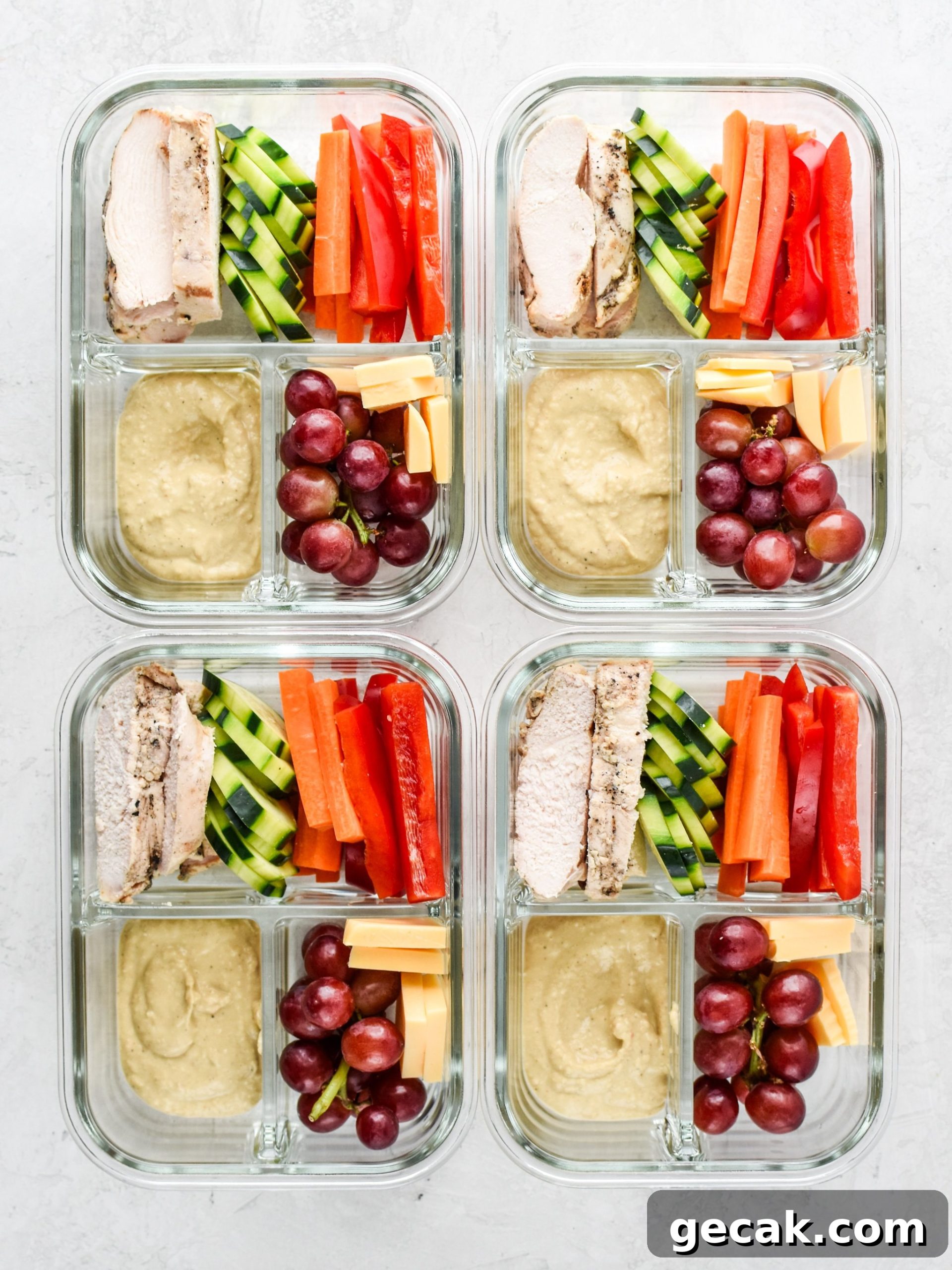 Chicken & Hummus Plate Lunch Meal Prep lunches with chicken, vegetables and hummus.