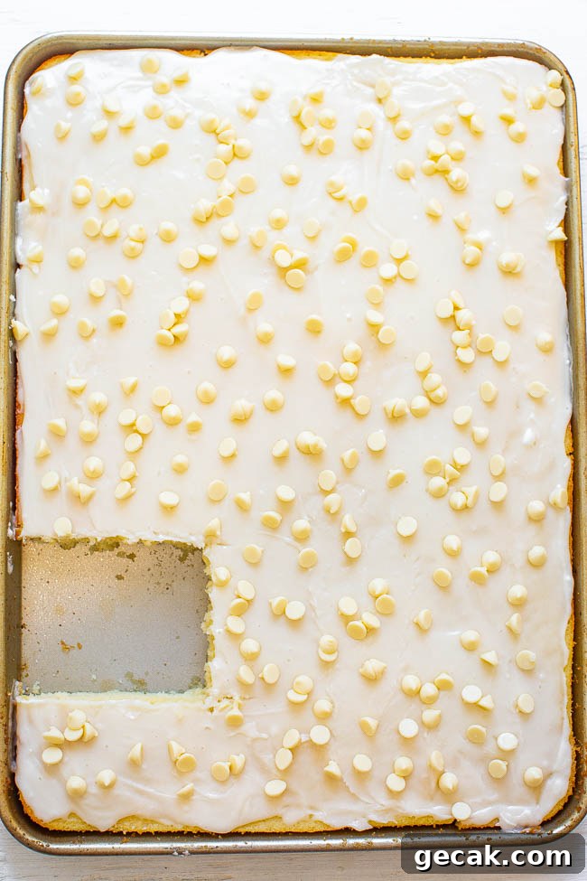 White Texas Sheet Cake — A fast, EASY, no-mixer cake that's soft, fluffy, tender, and just melts in your mouth!! The white chocolate twist on a traditional Texas chocolate sheet cake is DELISH! A perfect PARTY cake!!