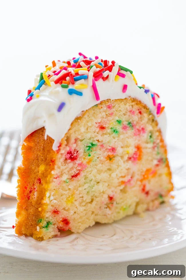 Slice of Easy Homemade Funfetti Bundt Cake on a white plate