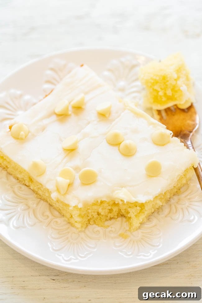 White Chocolate Texas Sheet Cake - A fast, EASY, no-mixer cake that's soft, fluffy, tender, and just melts in your mouth!! The white chocolate twist on a traditional Texas chocolate sheet cake is DELISH! A perfect PARTY cake!!