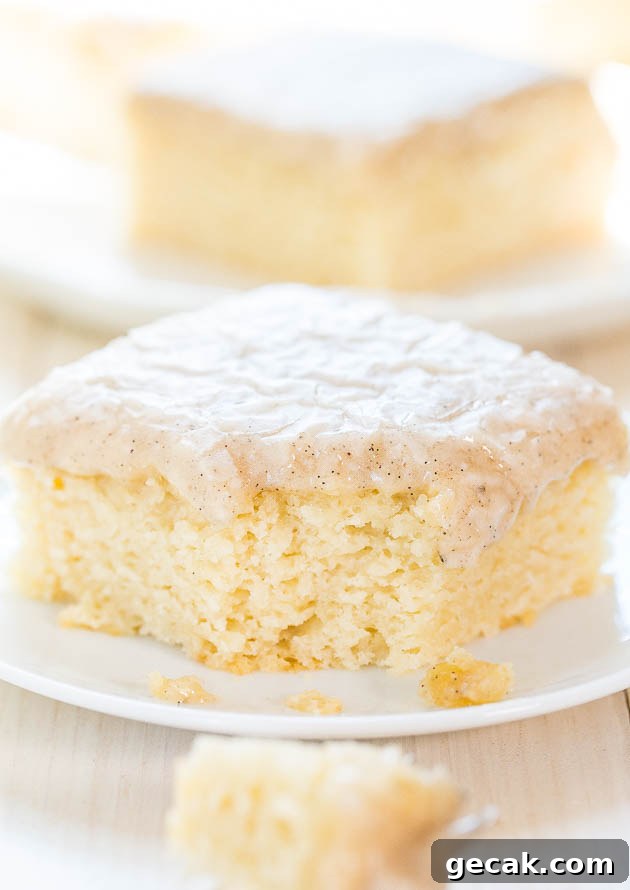 Vanilla Cake with Vanilla Bean Browned Butter Glaze on a white plate