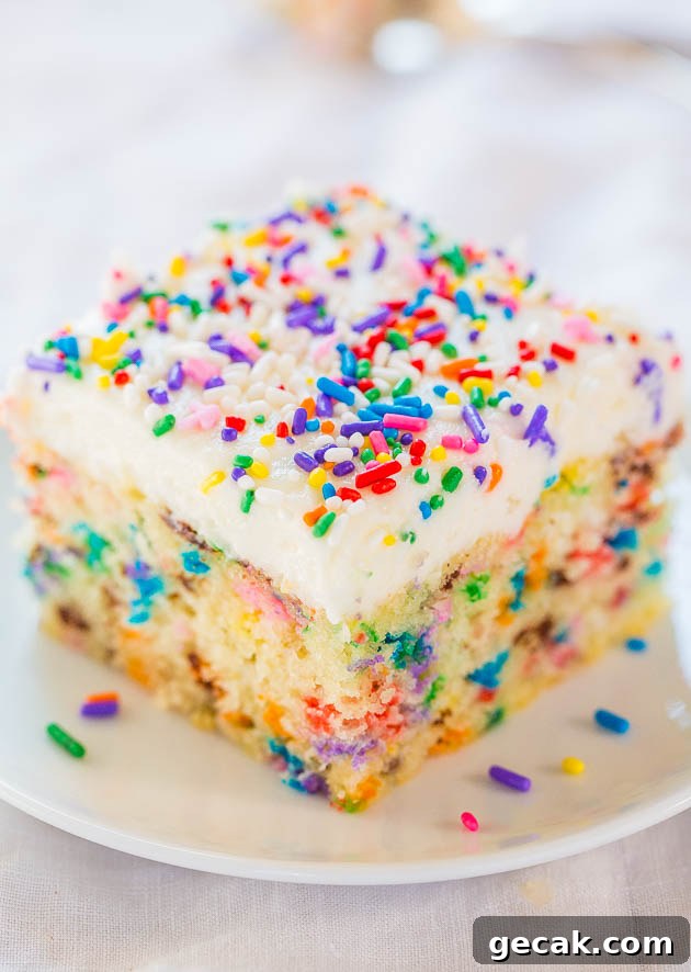 Easy Homemade Funfetti Cake with Vanilla Buttercream  on a white plate