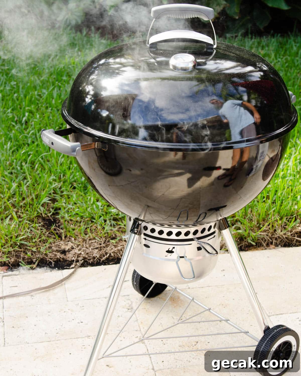 Getting the grill to a steady smoke point.