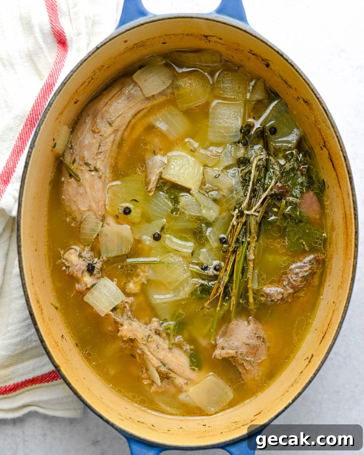 Simmered turkey bones and vegetables in a dutch oven