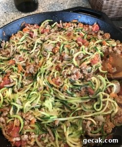 mix zucchini noodles with sauce